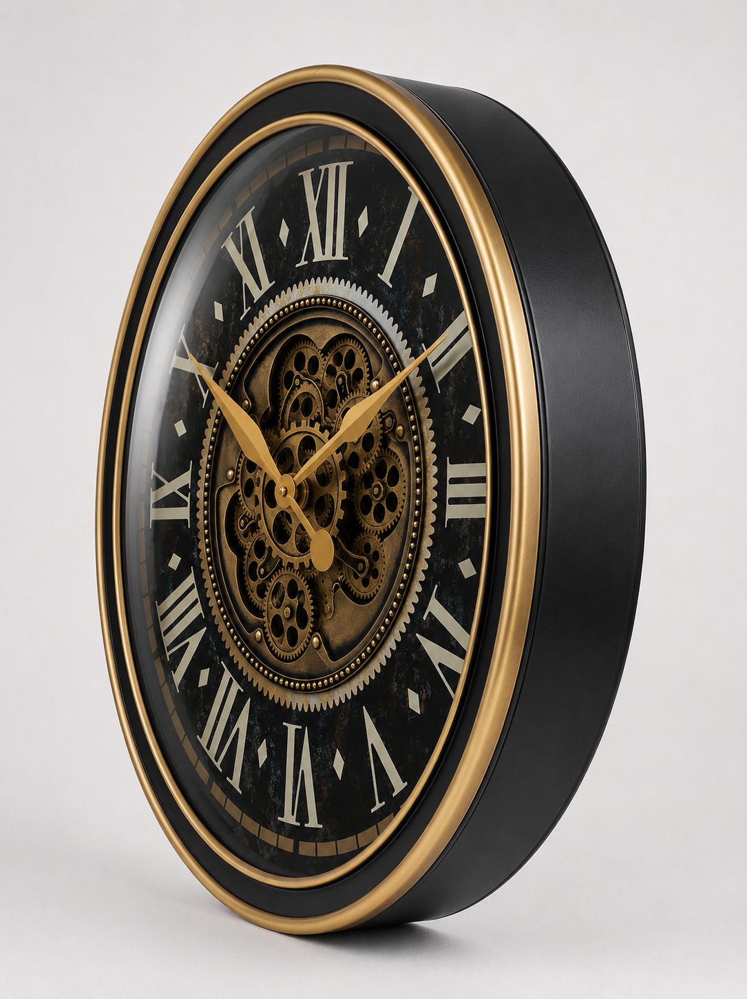 Decorative wall clock with black face, gold hands, and detailed gears on a white background
