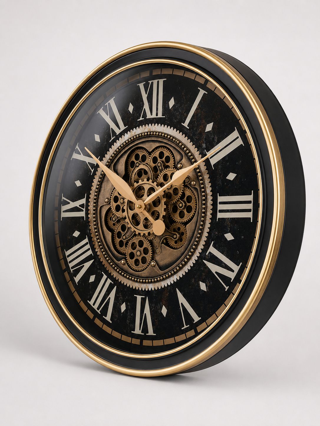 Decorative wall clock with black face, gold rim, and Roman numeral markers on a white background
