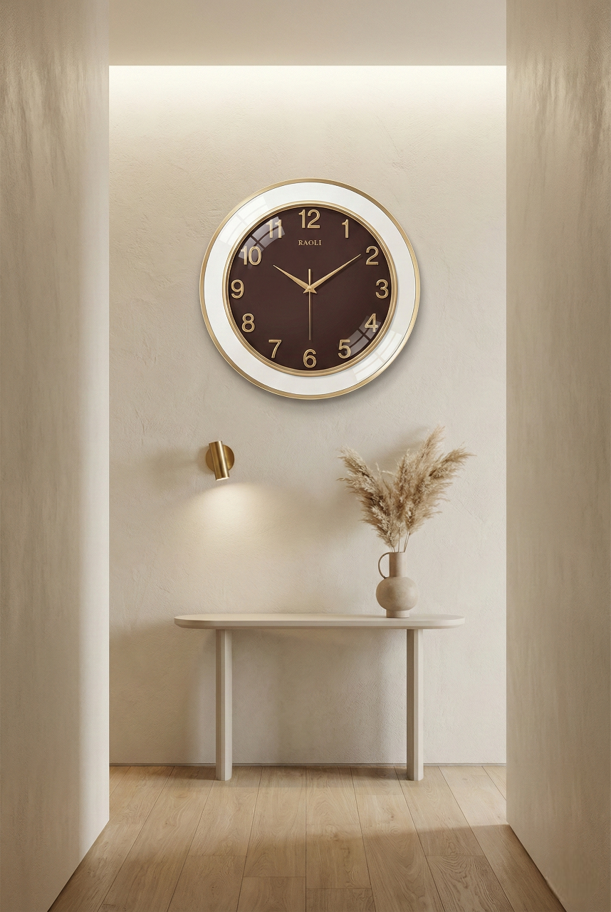 Round wall clock on a wall with a minimalistic decor setup.