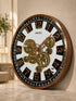 Angled perspective of black and gold moving gear wall clock with premium finish