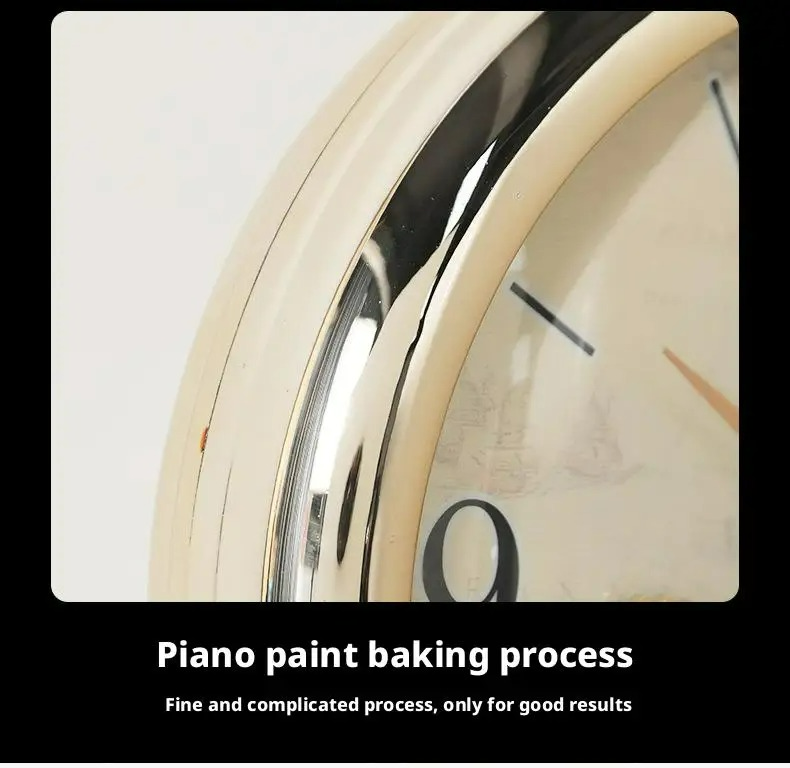 Close-up of a clock with gold rim and white face, text indicating piano paint baking process.