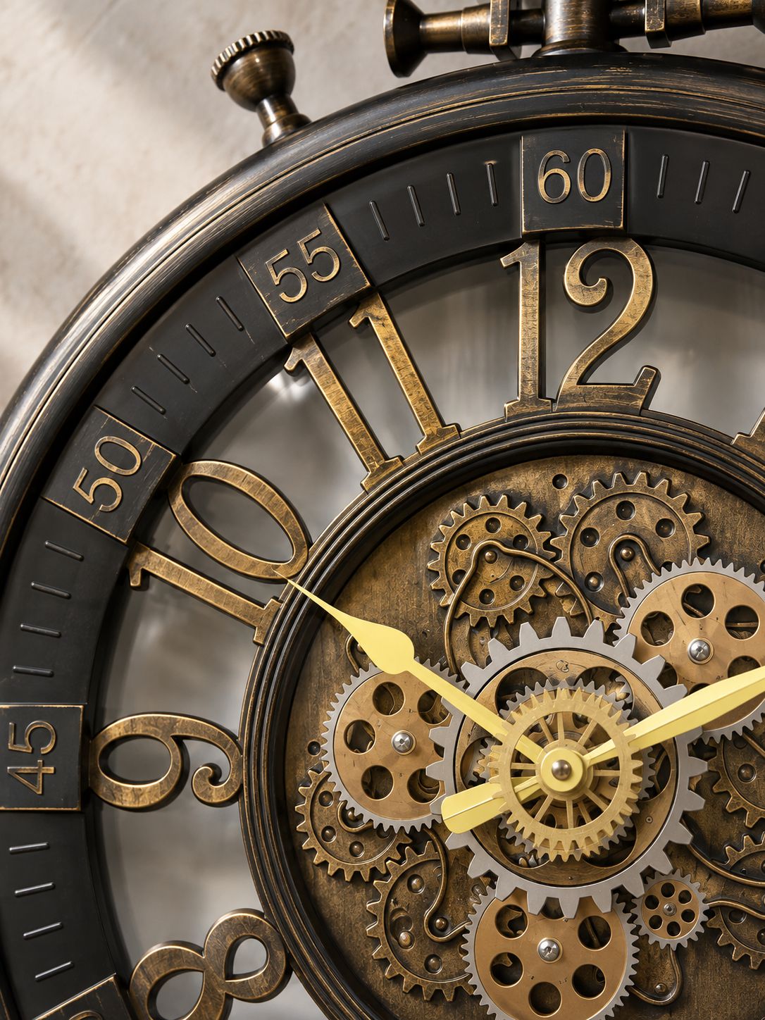 Close-up of a vintage-style mechanical pocket watch with exposed brass gears, gold-toned numerals, and dark metal casing on a neutral background.
