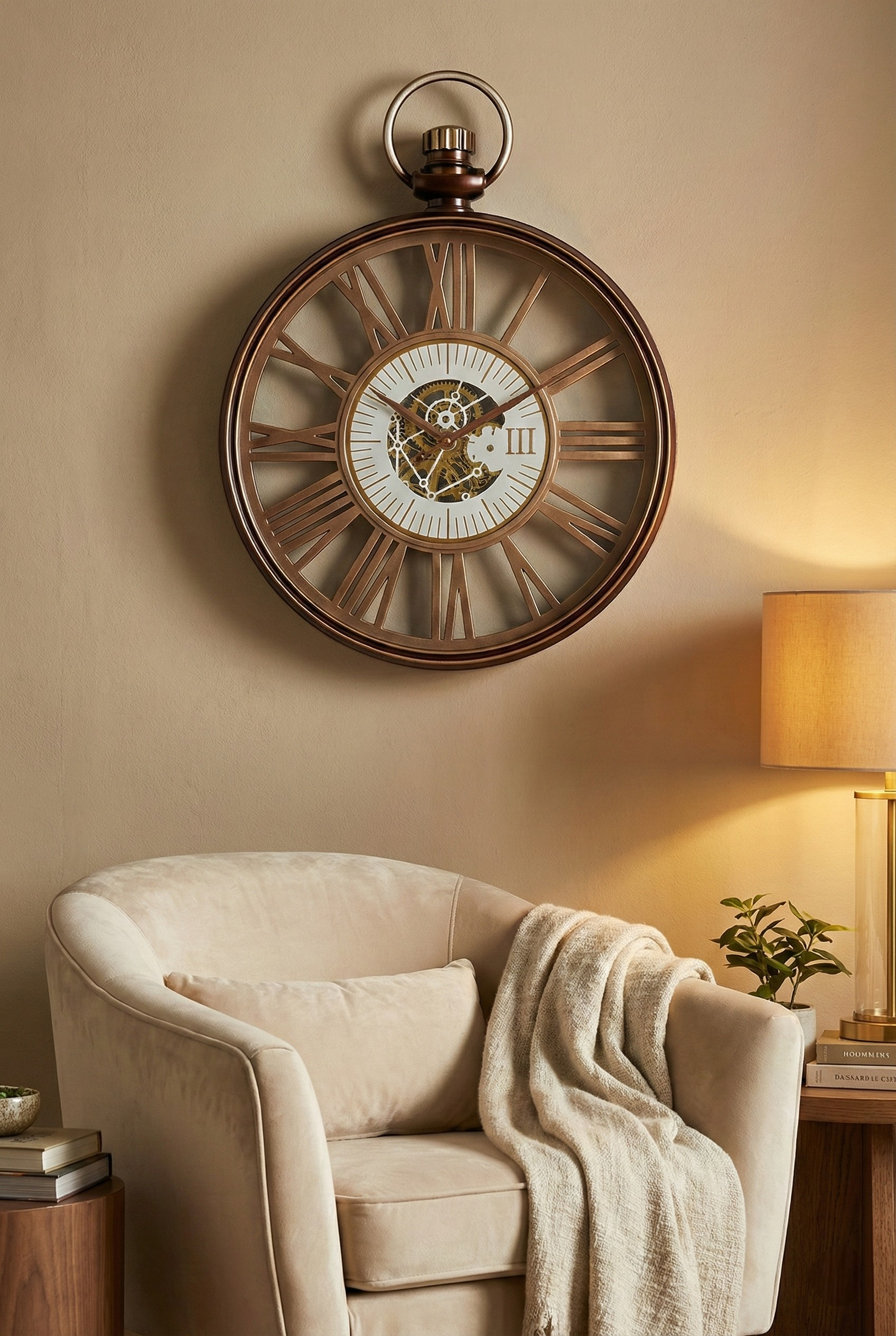 Decorative wall clock on a beige wall above a cozy armchair with a lamp and plant in the background.