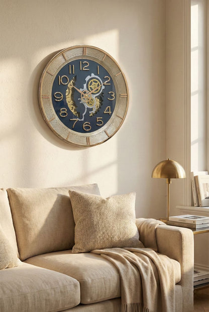 Decorative wall clock on a wall above a beige sofa in a living room.