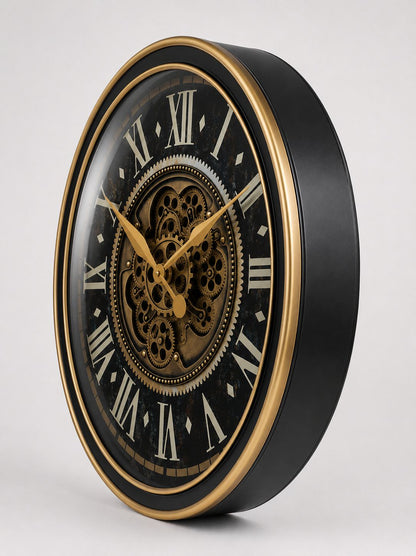 Decorative wall clock with black face, gold hands, and detailed gears on a white background
