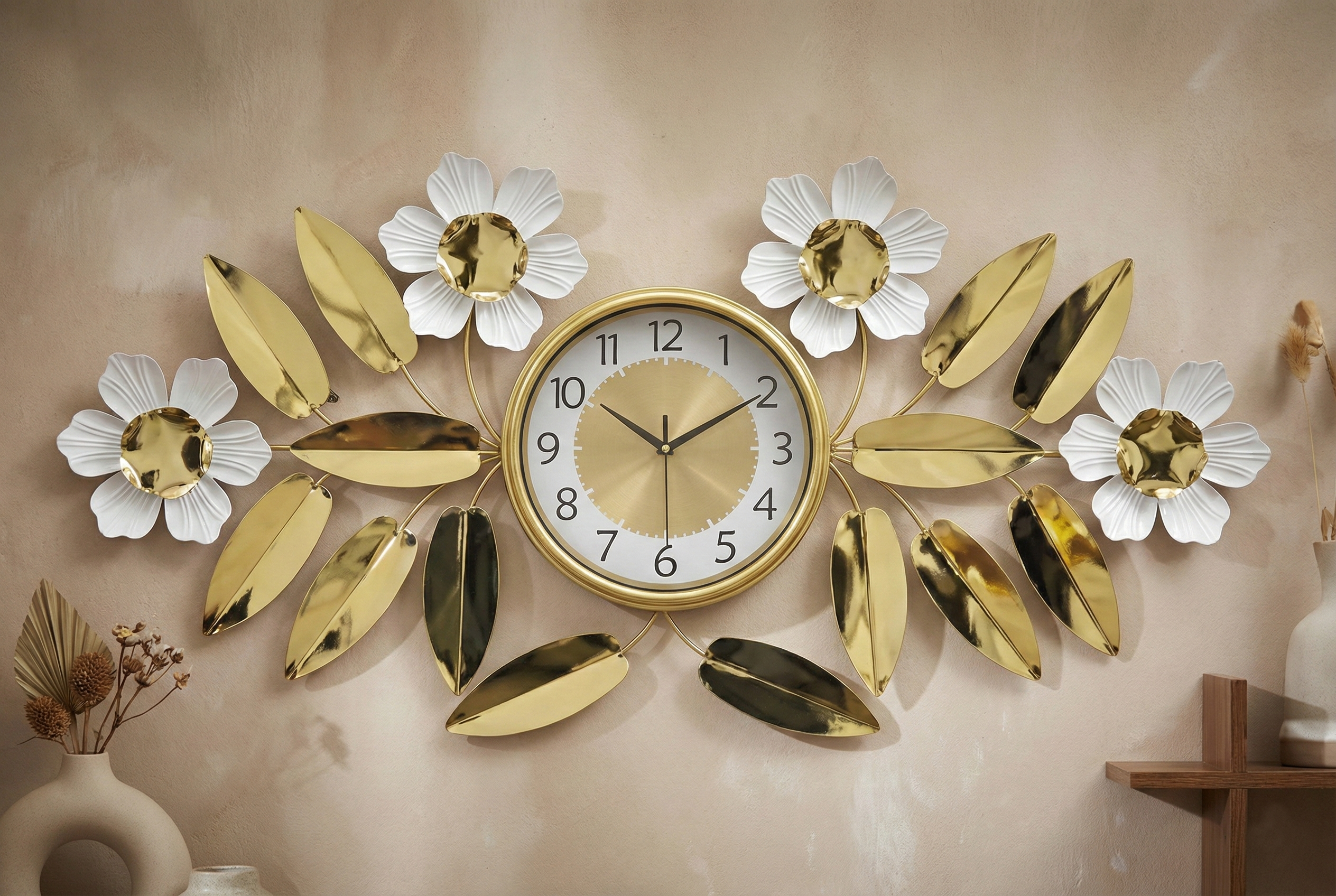 Decorative wall clock with floral and leaf designs on a beige wall.