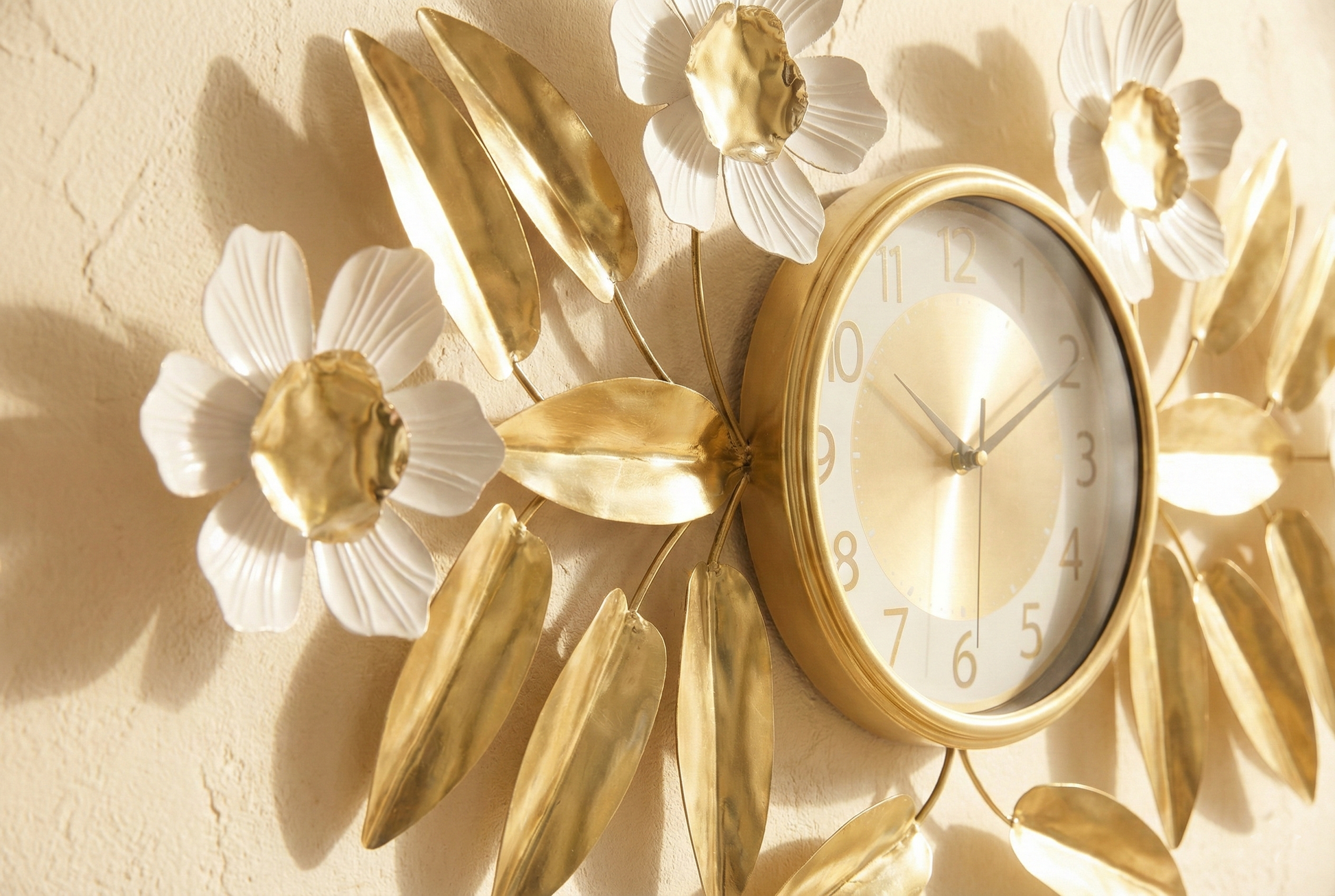 Decorative wall clock with floral design on a beige background