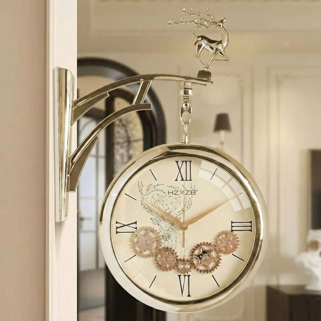 Decorative wall clock with gear design and deer figurine on a blurred background