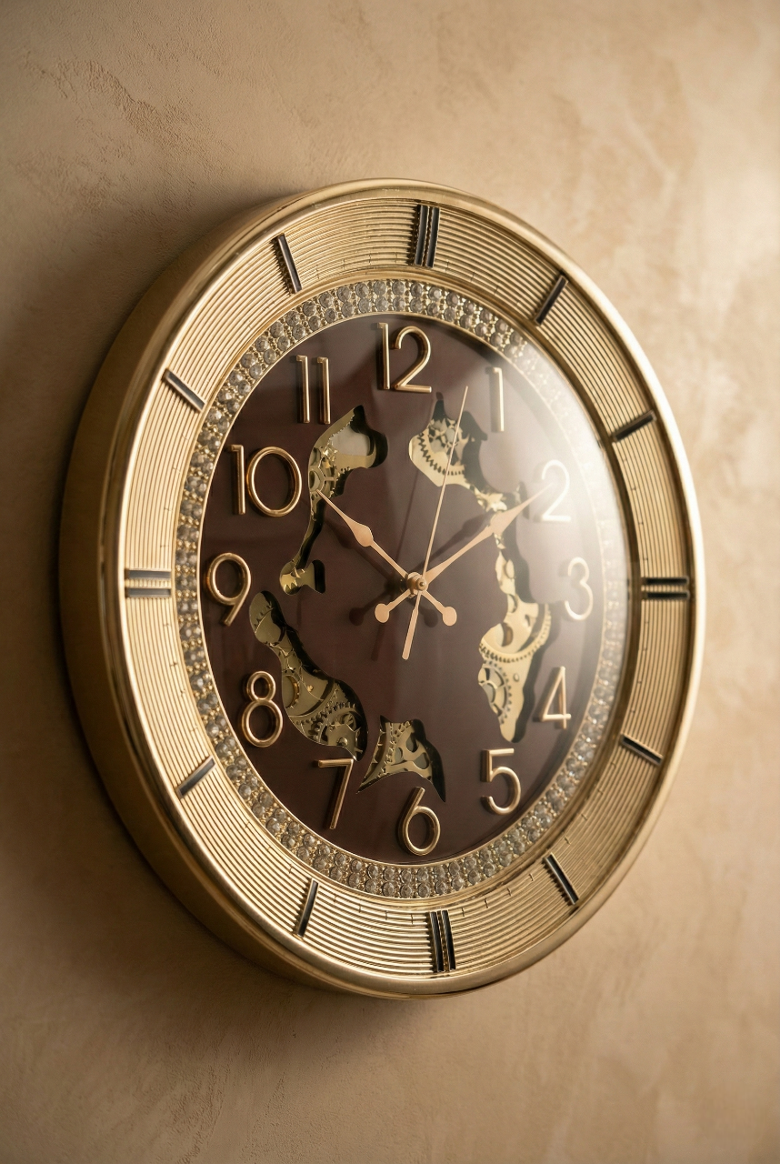Decorative wall clock with gold frame and brown face on a beige wall.