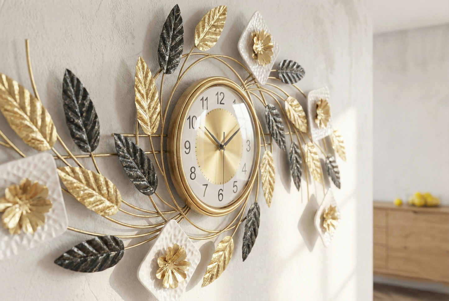 Decorative wall clock with leaf designs on a light-colored wall.