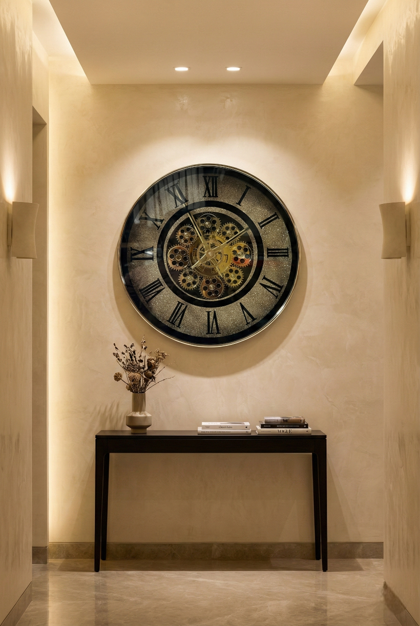 Decorative wall clock with mechanical design on a beige wall in a well-lit hallway.