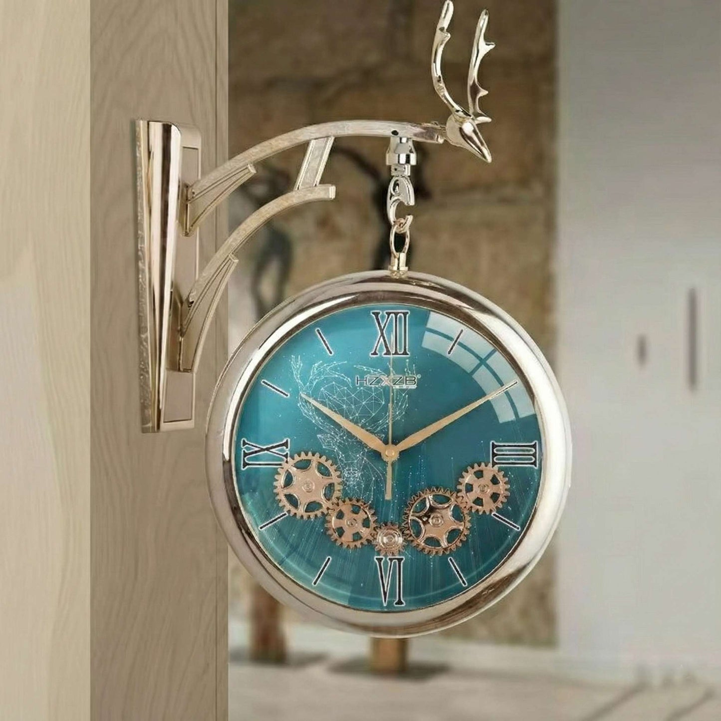 Decorative wall clock with turquoise face and gold gears on a wooden surface.