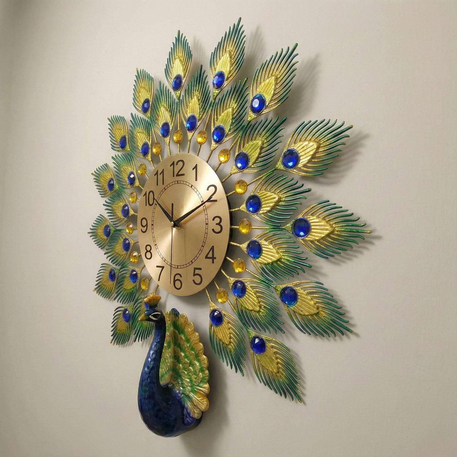 Decorative wall clock with peacock feather design on a plain background