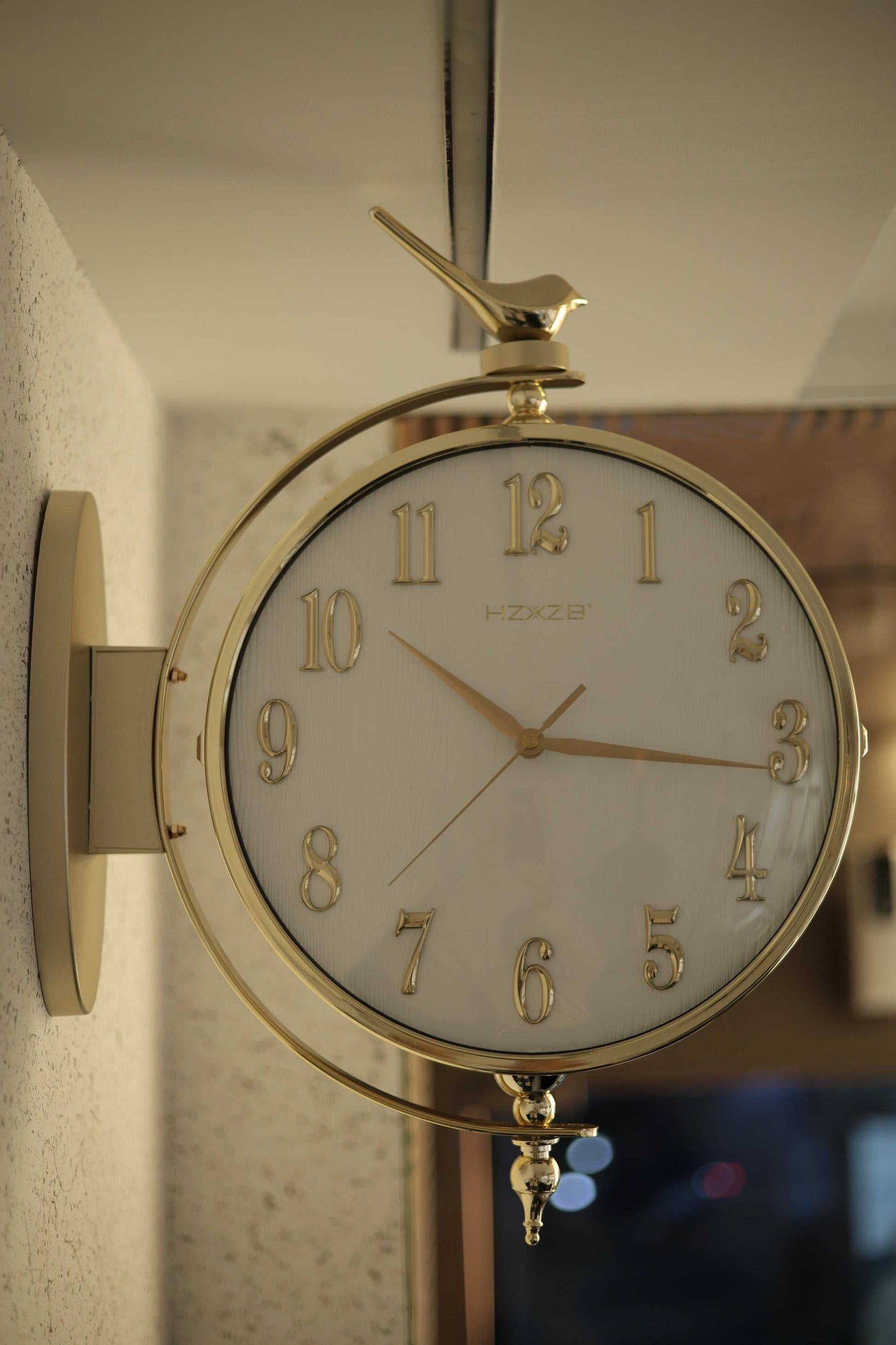 Double-sided deer wall clock mounted in modern living room