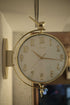 Double-sided deer wall clock mounted in modern living room