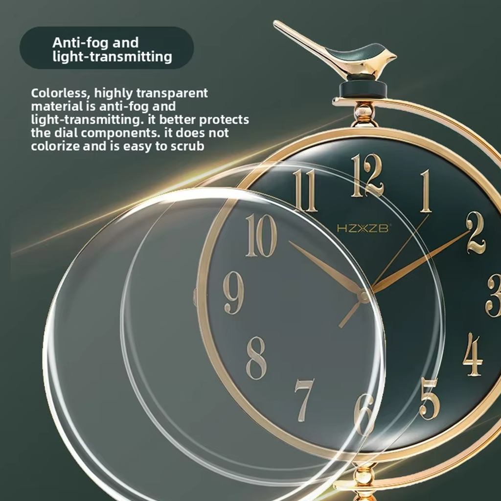Glass protector over a clock face with text on anti-fog and light-transmitting properties.