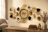 Large gold and black metal floral wall clock with white 3D flowers