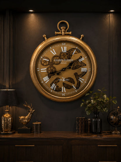 Large ornate clock on a dark wall with decorative items below