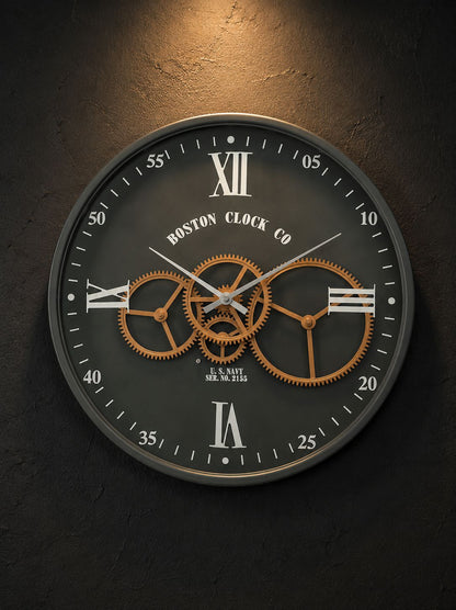 Luxury black metal moving gear wall clock on textured dark accent wall