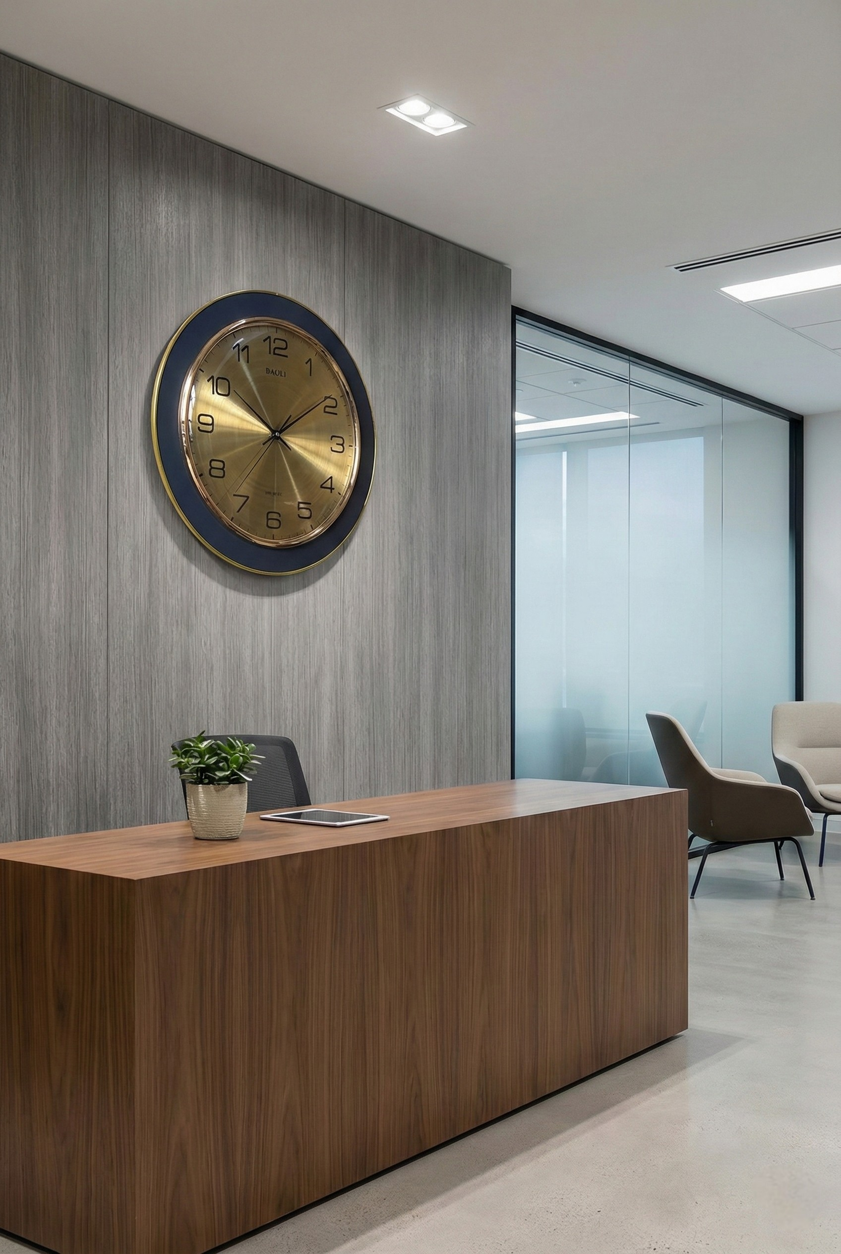 Modern office interior with a wooden reception desk and decorative clock on the wall.