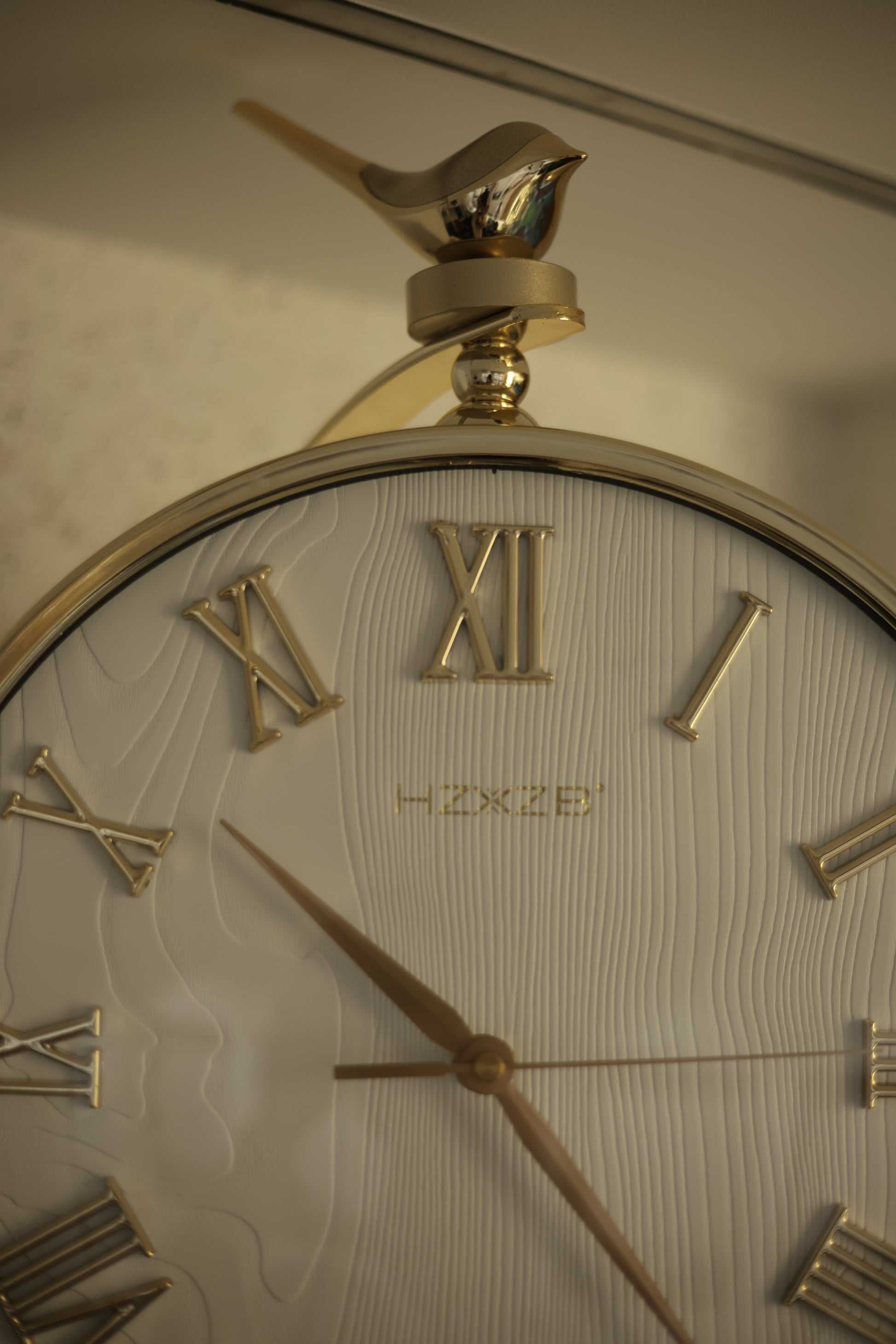 Roman numeral golden wall clock with matte green dial