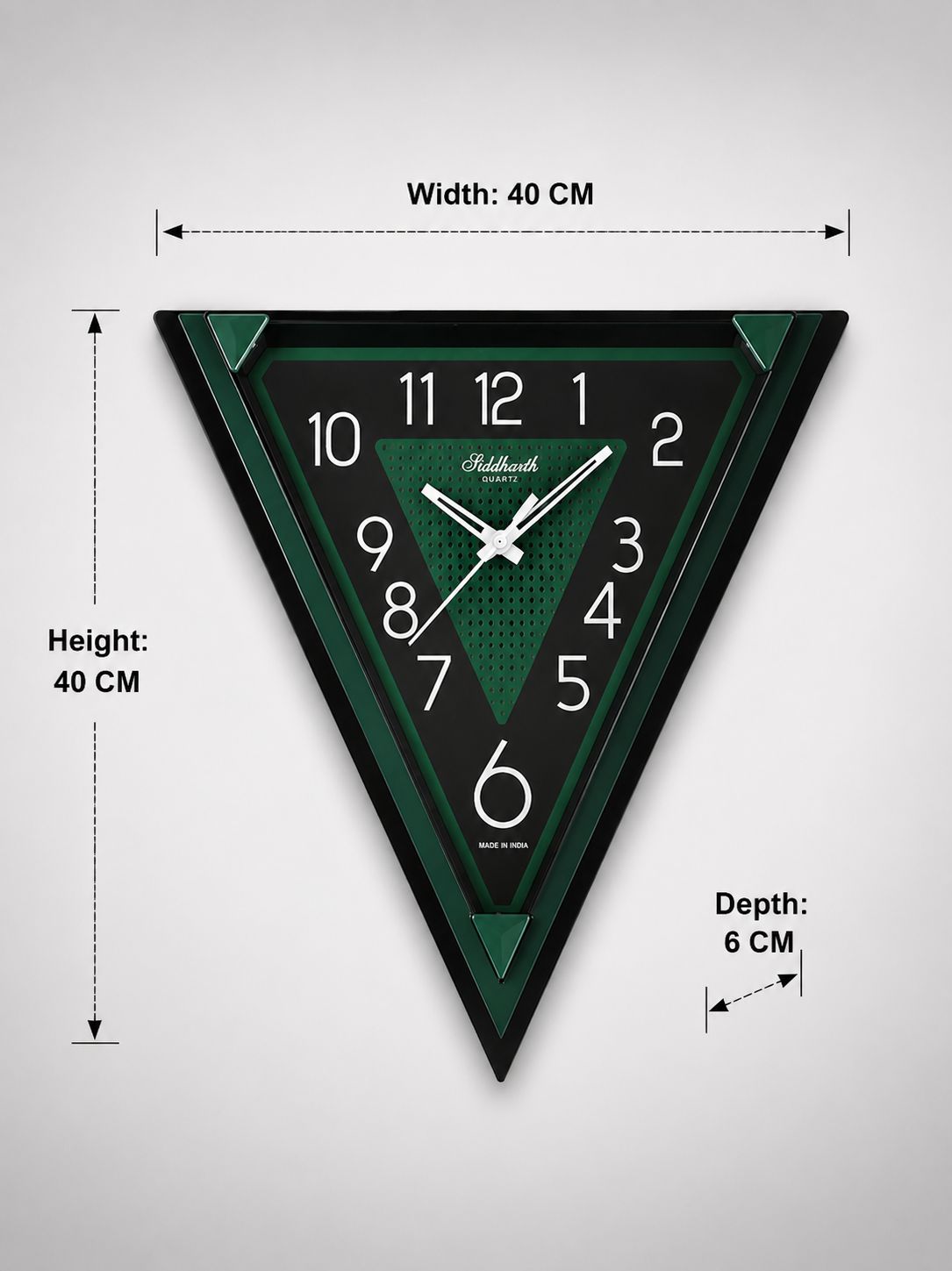 Triangle wall clock with black and green design, white Arabic numerals, and dimension markings showing width, height, and depth on a light gray background.