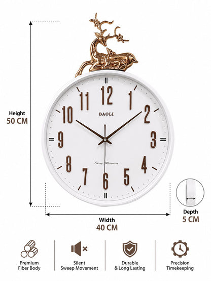 White round wall clock with a gold deer finial on top, shown with dimension annotations indicating 50 cm height, 40 cm width, and 5 cm depth, plus feature icons for fiber body, silent sweep movement, durable long-lasting design, and precision timekeeping. Brand BAOLI is visible on the dial.